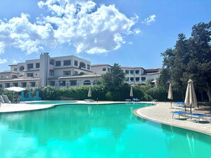 Seasonal outdoor pool, pool umbrellas, pool loungers