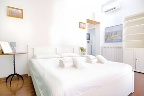 1 bedroom, desk, iron/ironing board, travel crib