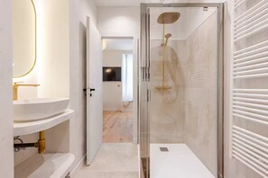 Shower, hair dryer, towels, soap