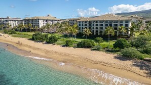 A beachfront hotel with multiple buildings, a sandy beach, and clear turquoise waters. - Westin Nanea in Lahaina, Maui. 2 bedroom, 2 bathroom (Lahaina)