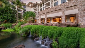 A hotel with a lush garden, a small waterfall, and a pool. - Westin Nanea in Lahaina, Maui. 2 bedroom, 2 bathroom (Lahaina)