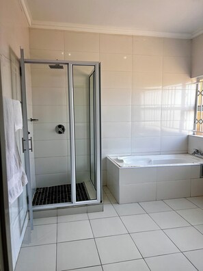 Shower, towels, soap, toilet paper
