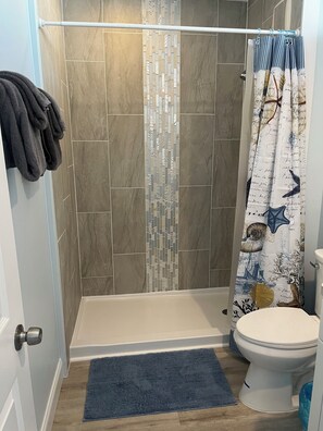 Shower, towels, toilet paper