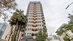 A high-rise building with a modern architectural design, featuring a grid-like facade and balconies. -  1 Bedroom Apartment with pool 600m from Moema/SP metro station NPZ093 (São Paulo)