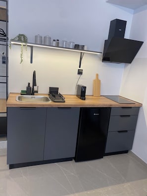 Suíte família | Cozinha privada | Frigobar, cooktop, talheres/pratos/utensílios de cozinha