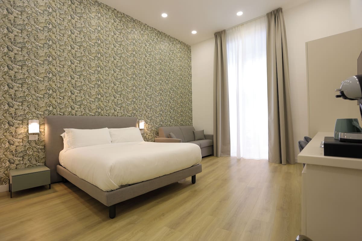 Deluxe Room, Balcony, City View | In-room safe, desk, laptop workspace, blackout curtains