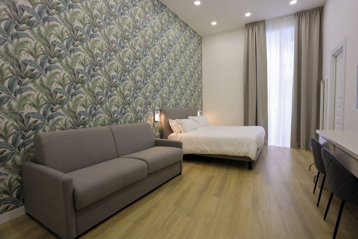 Deluxe Room, Balcony, City View | In-room safe, desk, laptop workspace, blackout curtains