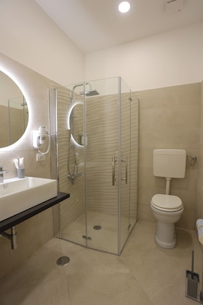Comfort Room, Courtyard View | Bathroom | Shower, hair dryer, towels, soap