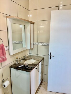 Hair dryer, towels, soap, toilet paper