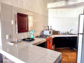 Fridge, microwave, stovetop, cookware/dishes/utensils