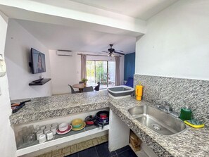 Fridge, microwave, stovetop, coffee/tea maker