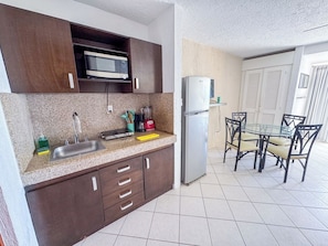 Fridge, microwave, stovetop, coffee/tea maker