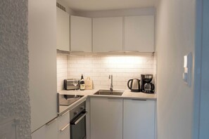 Fridge, dishwasher, cookware/dishes/utensils, dining tables