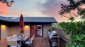 A wooden deck with a barbecue grill, dining table, and chairs. - Sedona Retreat • Newly Renovated 3BR Home - Amazing Views (Sedona)