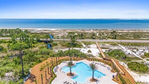 A resort with a pool, beach access, and a view of the ocean. - Beach House - Redfish Cove by PHG (Port St. Joe)