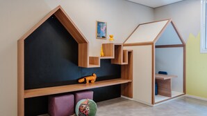 A children's play area with built-in storage and seating.