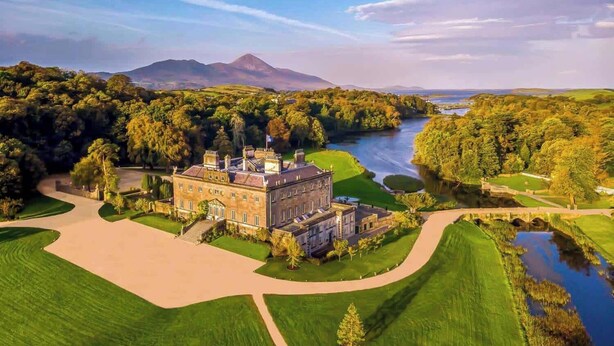 Westport House, a large stately building surrounded by lush greenery and a river, with a clear view of the surrounding landscape. - Clarin Rest, luxury private room, Clarinbridge Wild Atlantic Way, Galway. (Co Galway)