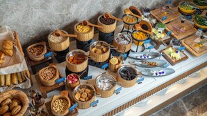 A buffet with various food items and containers.