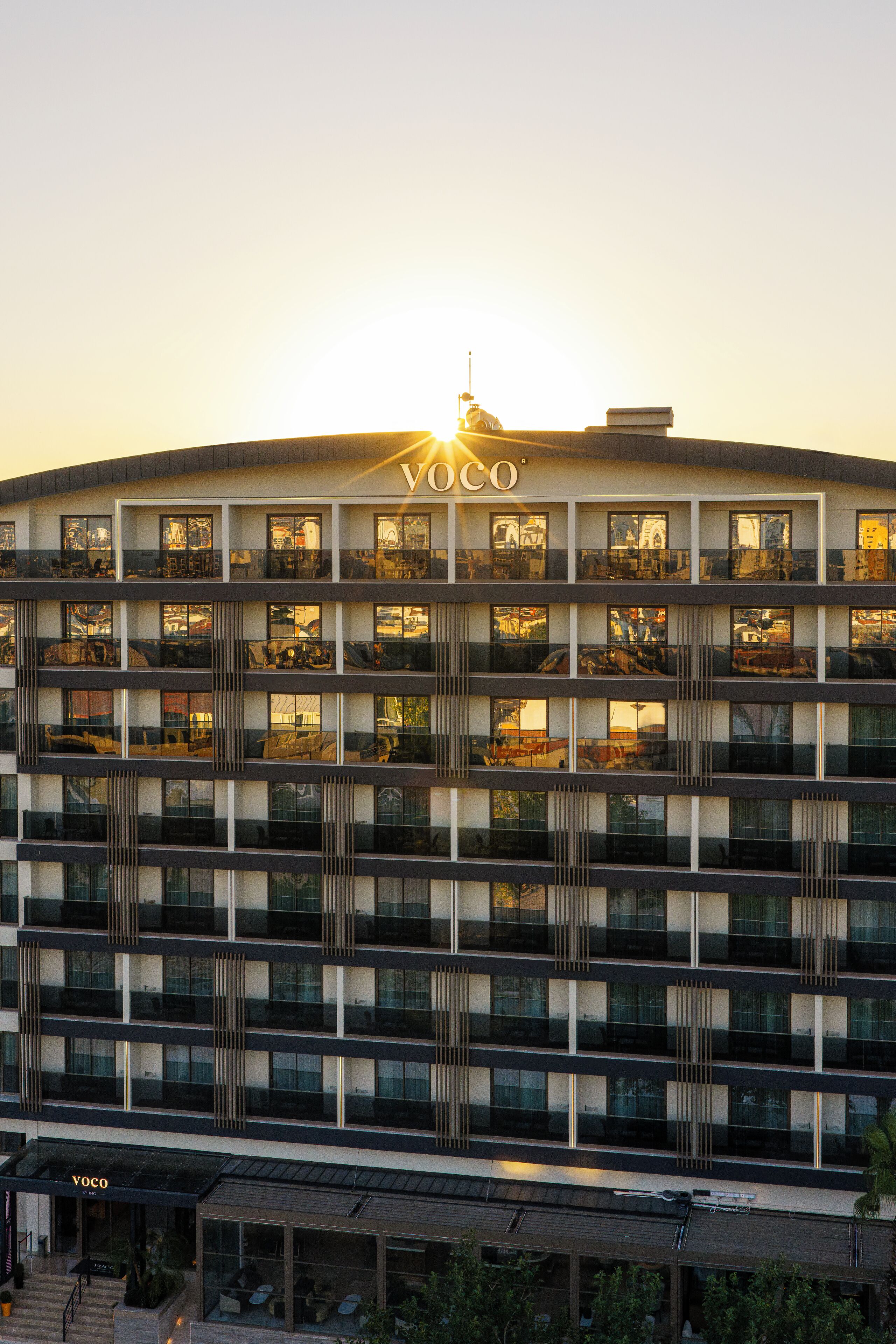 A multi-story building with the name 'VOCO' prominently displayed at the top.