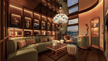 A luxurious living room with a sectional sofa, a coffee table, and a chandelier.
