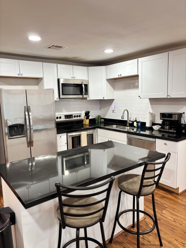 Microwave, oven, stovetop, dishwasher - Spacious 5BR Getaway w/ Pool & Play Areas /South Phoenix Stay (Phoenix)