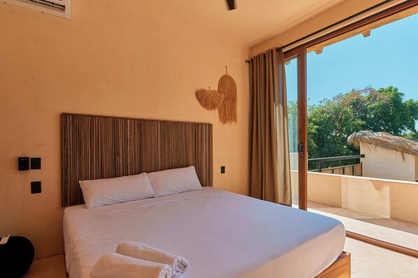 Suite, 1 King Bed, Partial Ocean View | In-room safe, iron/ironing board, free WiFi, bed sheets
