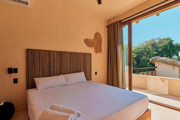 Suite, 1 King Bed, Partial Ocean View | In-room safe, iron/ironing board, free WiFi, bed sheets