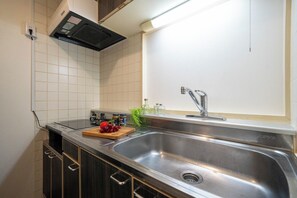 Fridge, microwave, cookware/dishes/utensils