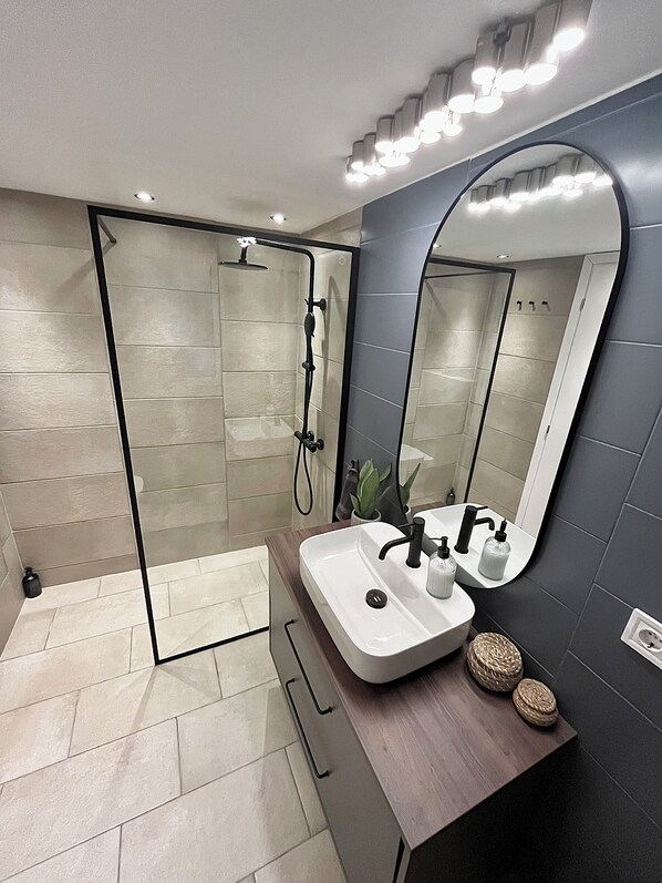 Shower, hair dryer, towels, soap