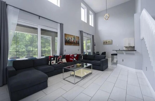 House | Living area | 75-inch Smart TV with digital channels, foosball, streaming services