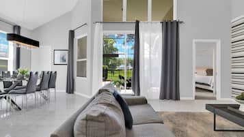 House | Living area | 55-inch Smart TV with digital channels, foosball, streaming services