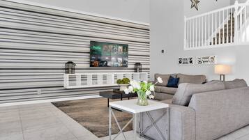 House | Living area | 55-inch Smart TV with digital channels, foosball, streaming services