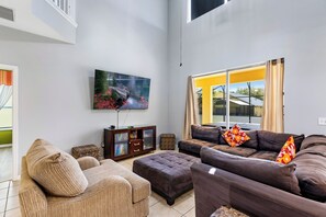 House | Living area | 55-inch Smart TV with digital channels, streaming services - Relax & Unwind – Stunning Home W/ Private Pool! (Kissimmee)