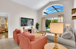 House | Living area | 55-inch Smart TV with digital channels, foosball, streaming services