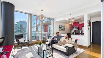 Good company and a sofa with a view. An easy evening at Red Ruby, imagined in an AI-staged lifestyle scene.