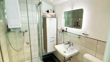 Hair dryer, towels, soap, toilet paper