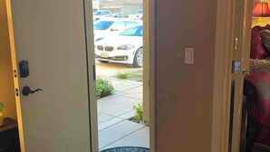 A room with a door leading to a parking area. - Gated community 2-bedroom,1 bath attached apartment in Manteca (Manteca)