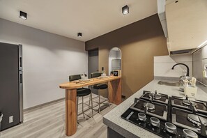 Fridge, microwave, stovetop, coffee/tea maker