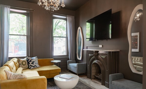 Smart TV, books - Red Brick Row by StayLage (St Louis)