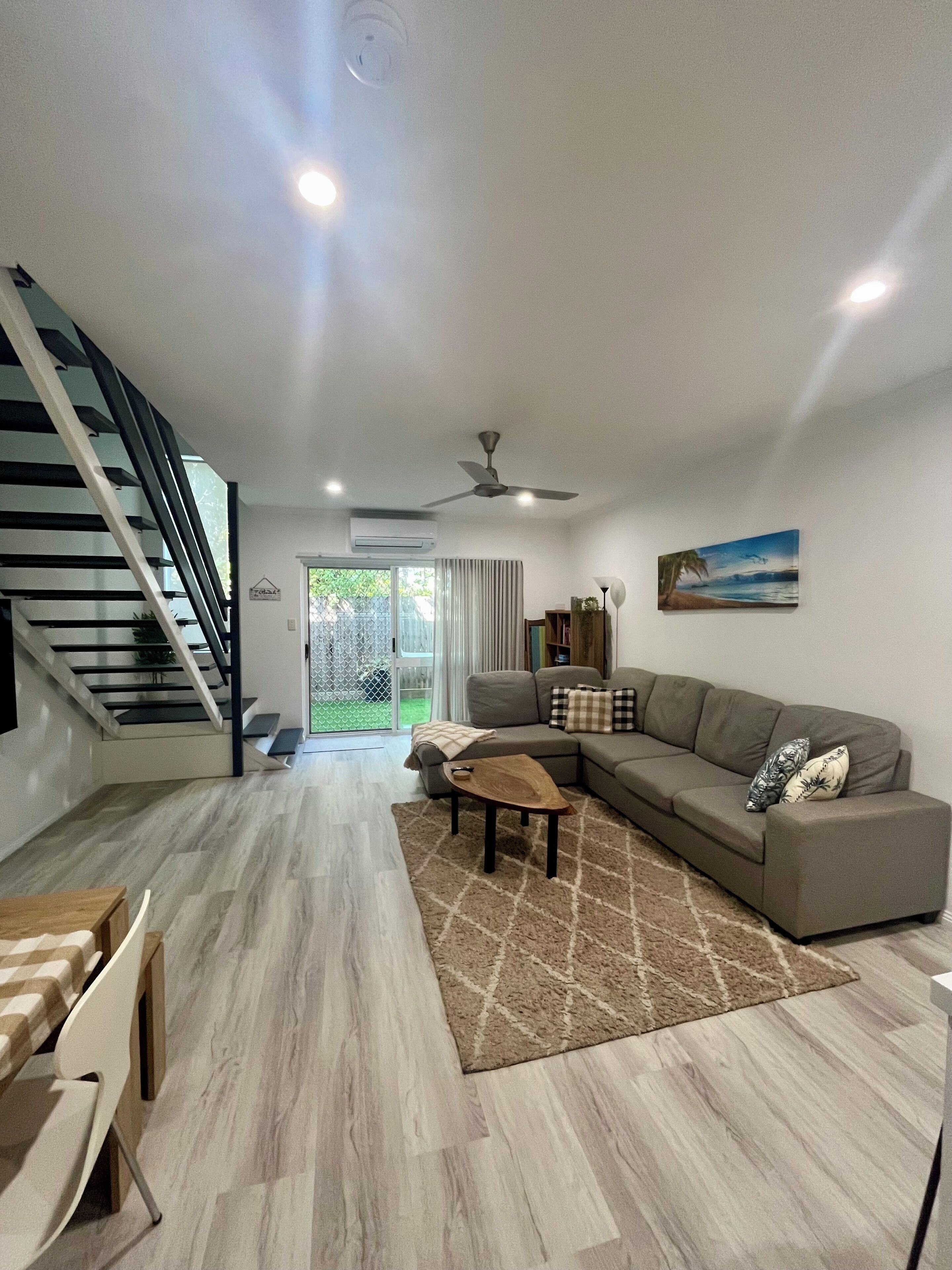 Open planned living area, comfy seating, 55" TV with streaming APPS, aircon, fan