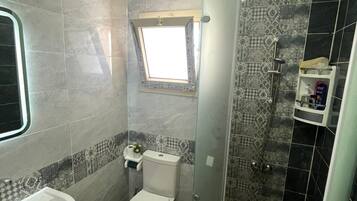 Shower, bidet, towels, soap