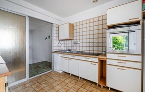 Fridge, stovetop, dishwasher, coffee/tea maker