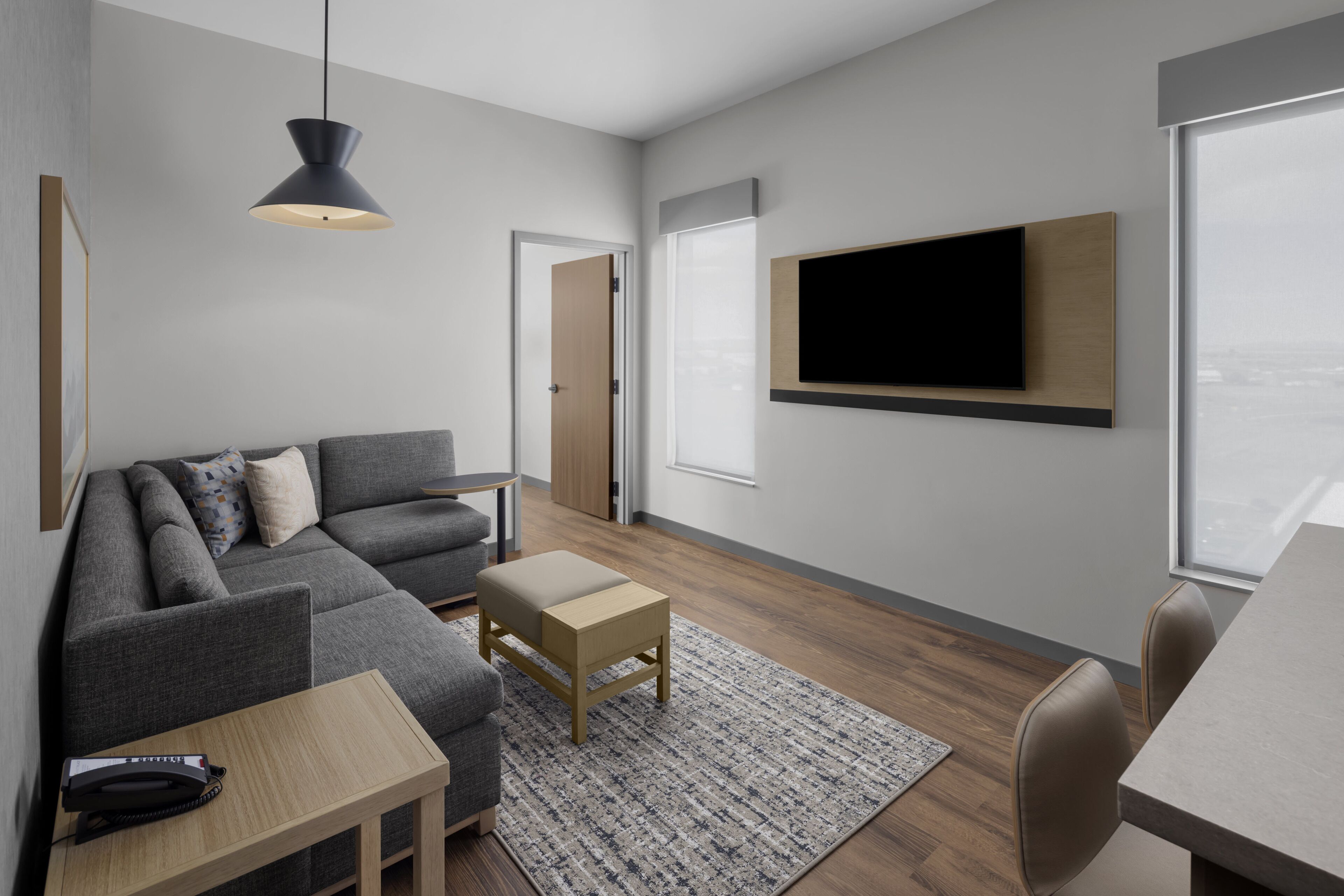 Suite, 1 King Bed with Sofa bed, Roll-in Shower, Kitchenette | Living area | 55-inch Smart TV with cable channels, Netflix, streaming services