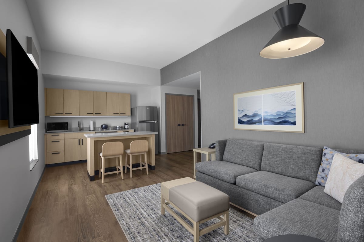 Suite, 1 King Bed with Sofa bed, Kitchenette | Living area | 55-inch Smart TV with cable channels, Netflix, streaming services