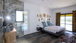 A modern bedroom with a large bed, a glass shower enclosure, and a view of the outdoors. - Cozy home in Montboucher sur Jabron (Montboucher sur Jabron)