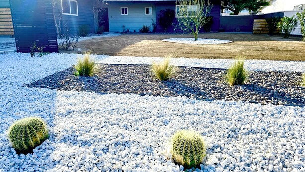 A residential area with a house, a gravel driveway, and a cactus garden. - Your Home Away From Home in the Sought Historic Huntridge Hills Neighborhood (Las Vegas)