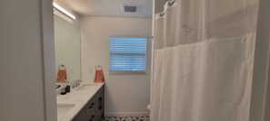 Shower, hair dryer, towels, soap