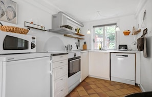 Fridge, stovetop, dishwasher, coffee/tea maker