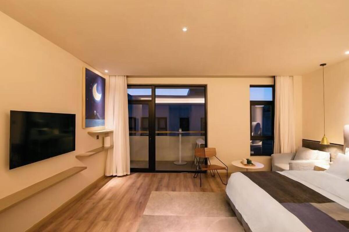 Down comforters, laptop workspace, blackout drapes, iron/ironing board