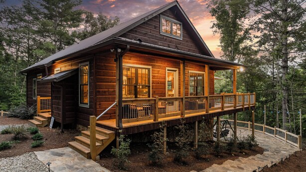 A rustic log cabin with a wooden deck and a stone pathway leading to the entrance. - Tranquil cabin with in charming Mineral Bluff with beautiful views (Mineral Bluff)